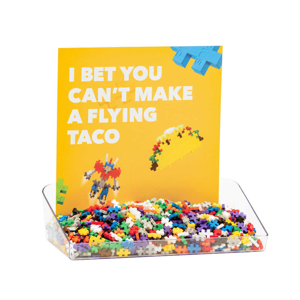 Inline demo tray with pieces and an I bet you can't make a flying taco sign