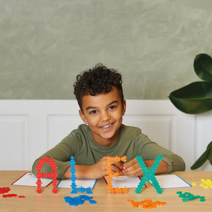 Learn To Build - ABC & 123: boy spelling ALEX with letter builds