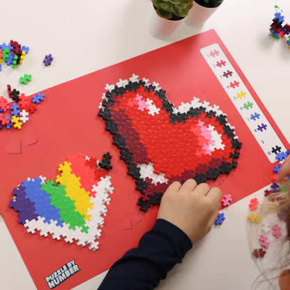 Puzzle By Number® - 250 pc Hearts being built on the guide