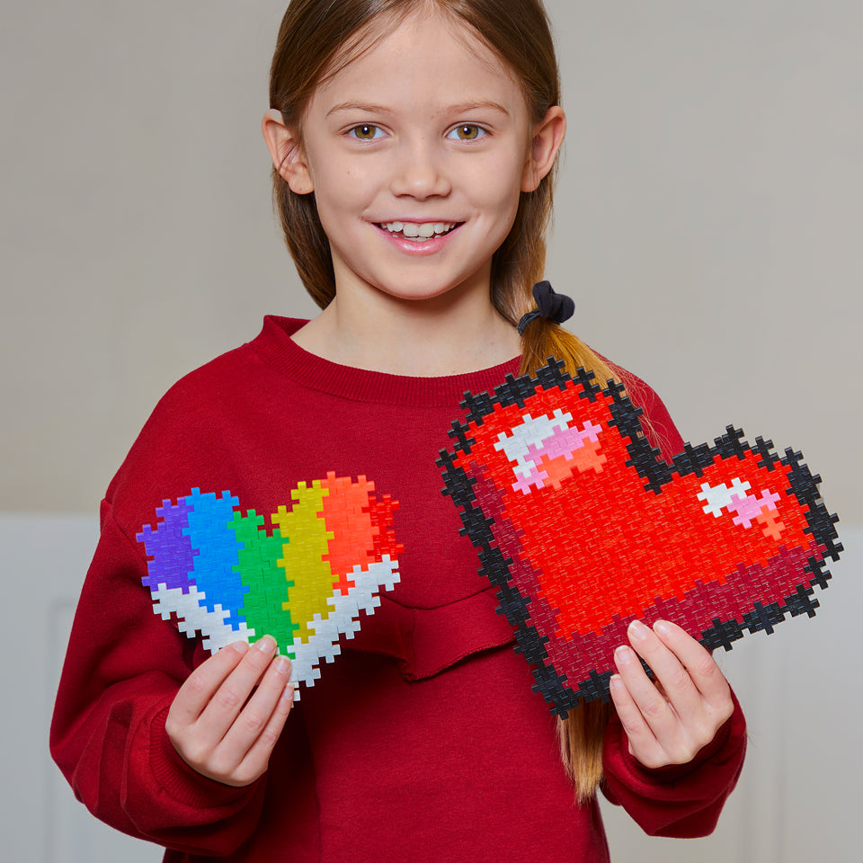Puzzle By Number® - 250 pc Hearts: girl holding two heart puzzles