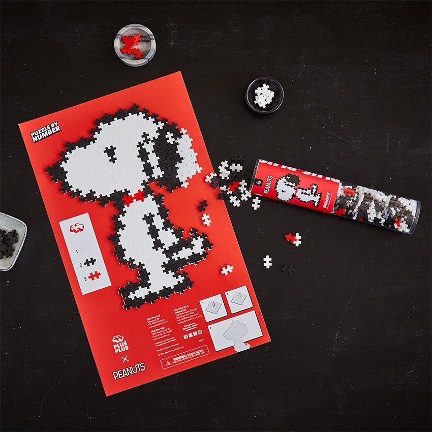 Snoopy - 275 pc Puzzle By Number®: completed Snoopy on the red puzzle sheet with tube