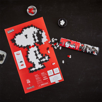 Snoopy - 275 pc Puzzle By Number®: completed Snoopy on the red puzzle sheet with tube