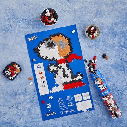 Flying Ace - 275 pc Puzzle By Number®: completed Flying Ace on the blue puzzle sheet with tube
